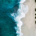 aerial photography of large body of water and shoreline